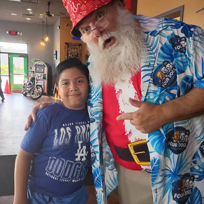 Santa Jim at a Four Dogs Christmas in July event