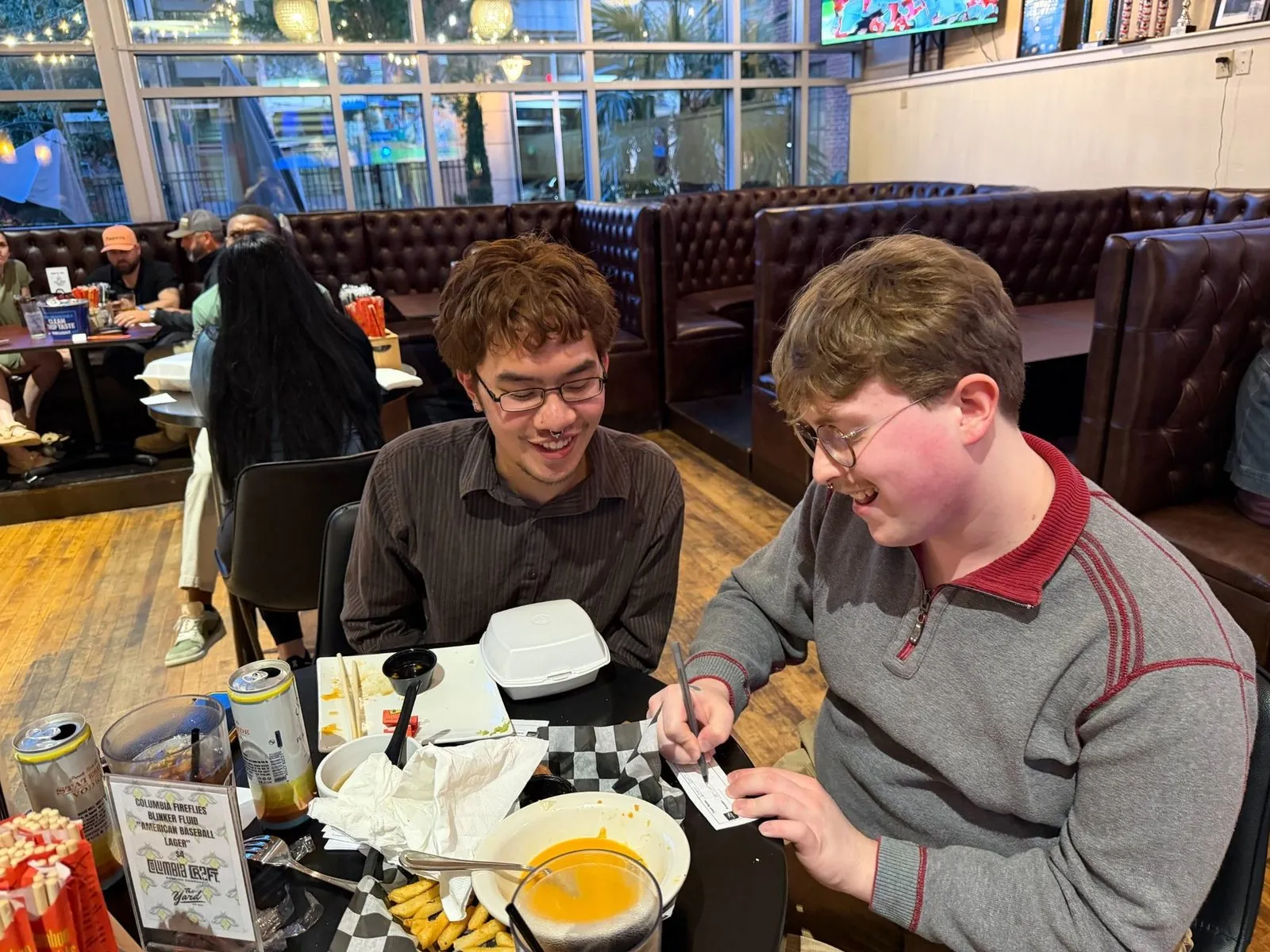 Guests playing together at a Four Dogs trivia night